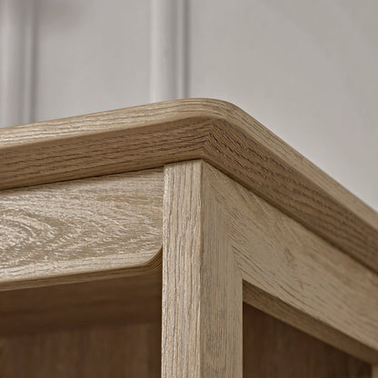 Eureka Ergonomic Ark El Oak Cabinet Corner, Showcasing Wood Grain Detail and Rounded Edge.