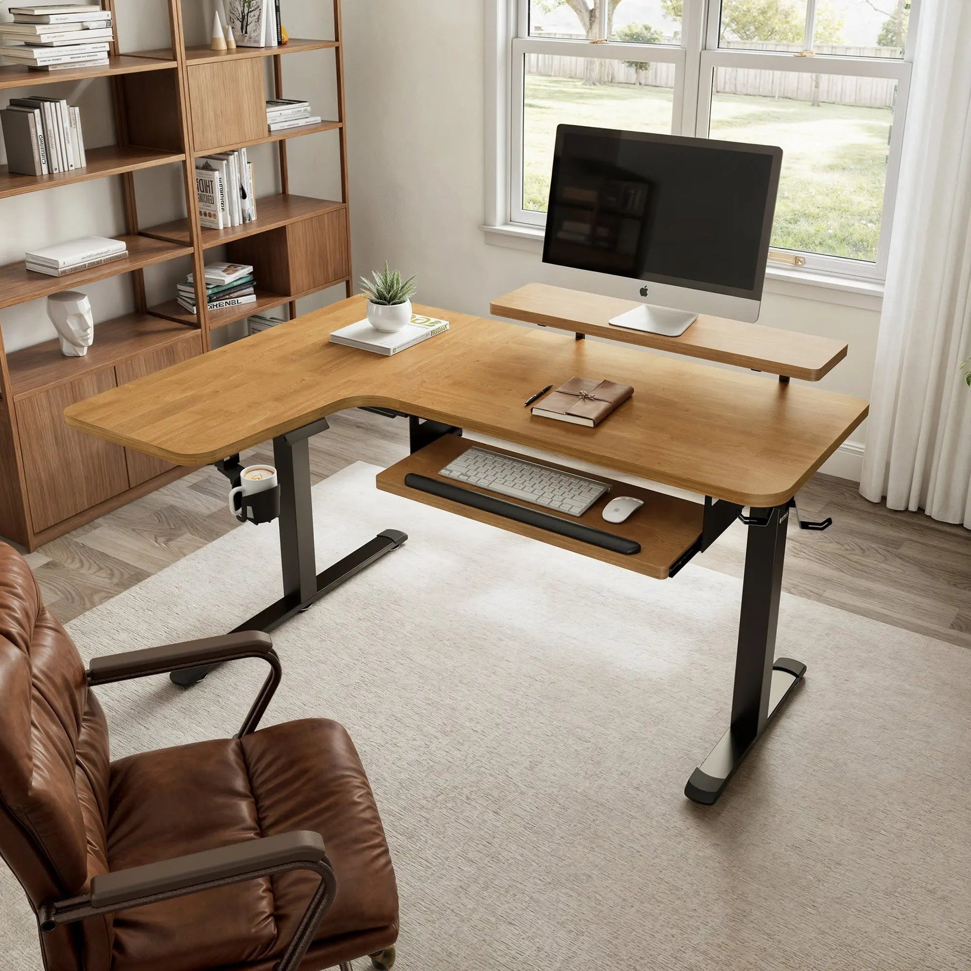 Ergonomic L-Shaped Standing Desk With Maple Top, Keyboard Tray, Monitor, and Accessories.