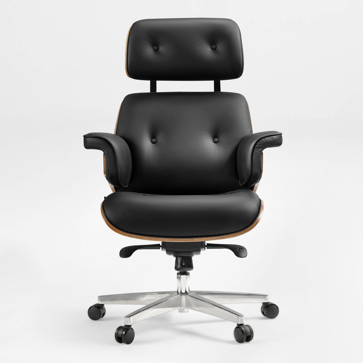 Eureka Ergonomic Mathias black Napa leather executive office chair with button tufting and wood veneer accents on a silver five-wheel base.