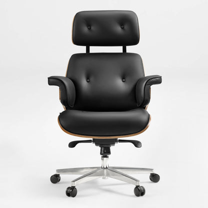 Eureka Ergonomic Mathias black Napa leather executive office chair with button tufting and wood veneer accents on a silver five-wheel base.