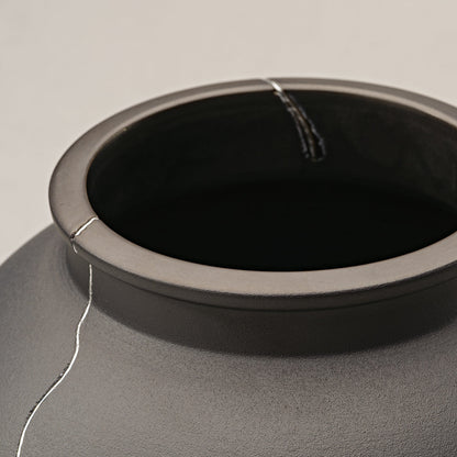 Dark Gray Ceramic Vase With Silver Crack Detail, Perfect for Dining Table Or Shelf Decor.