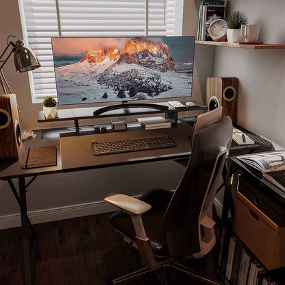 Ergonomic Workspace With Carbon Fiber Dual Monitor Stand and Modern Accessories for Comfortable Home Office Setup.