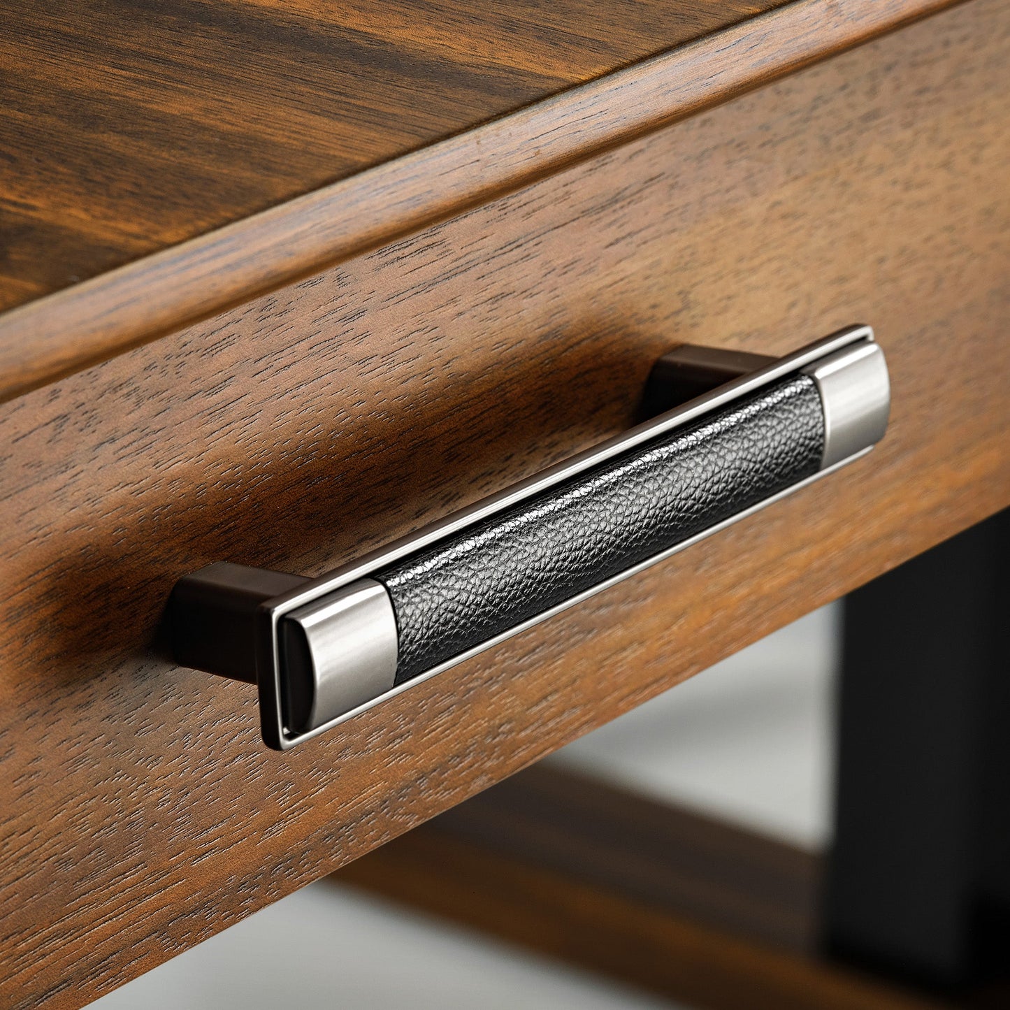 Eureka Ergonomic Ark Pro L-Shaped Desk Drawer Handle: Black Leather Grip, Walnut Wood, and Silver Accents.