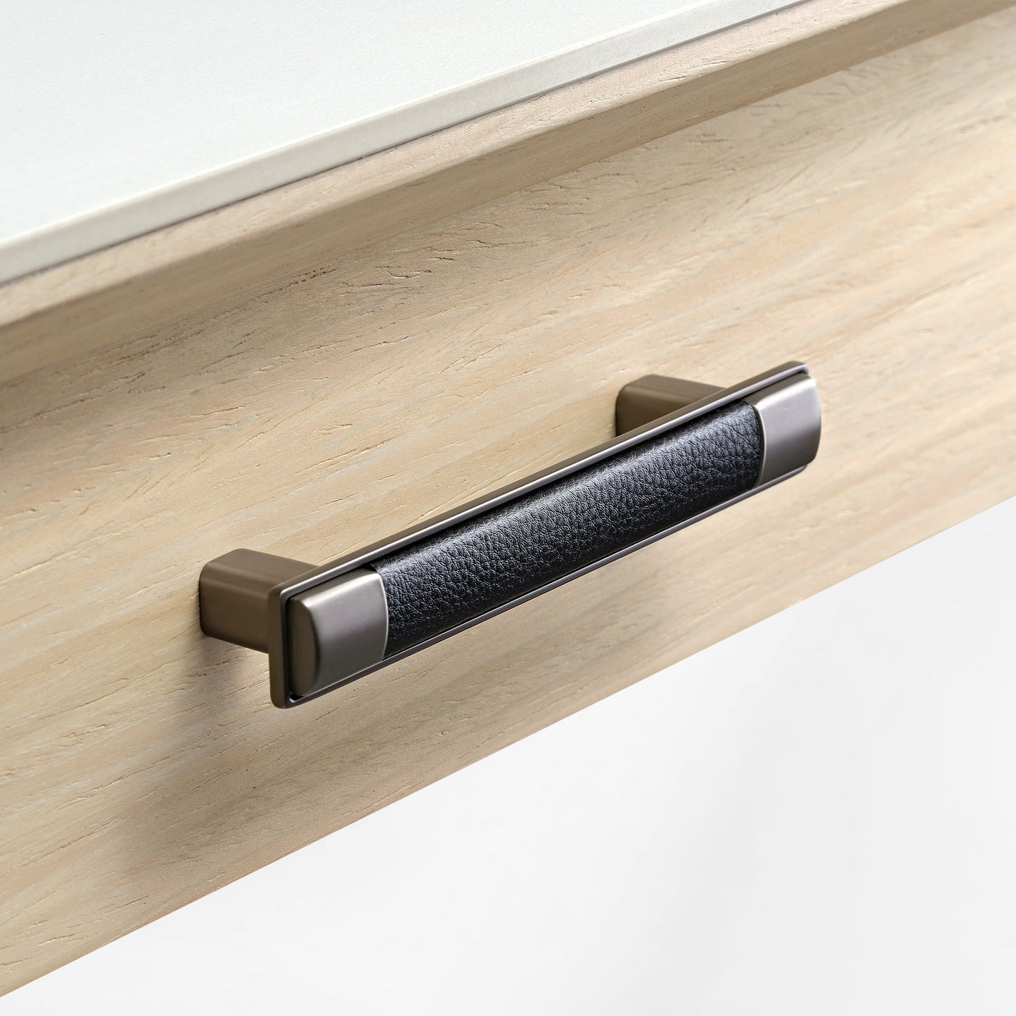 Eureka Ergonomic Ark Pro Desk Drawer Handle Detail. Black Leather Grip and Wood Grain Accent for Luxury Desk.