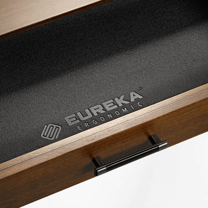 Eureka Ergonomic Ark Pro L-Shaped Desk Drawer Detail: Walnut Wood, Black Leather Handle, and Brand Logo.