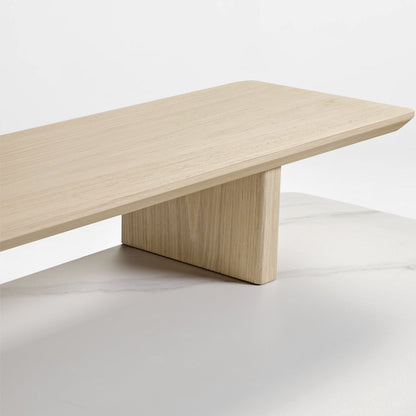 Eureka Ergonomic Ark Pro Desk Detail: Wooden Shelf With Wood Grain, Light Color, Atop a Black Sintered Stone Desk.