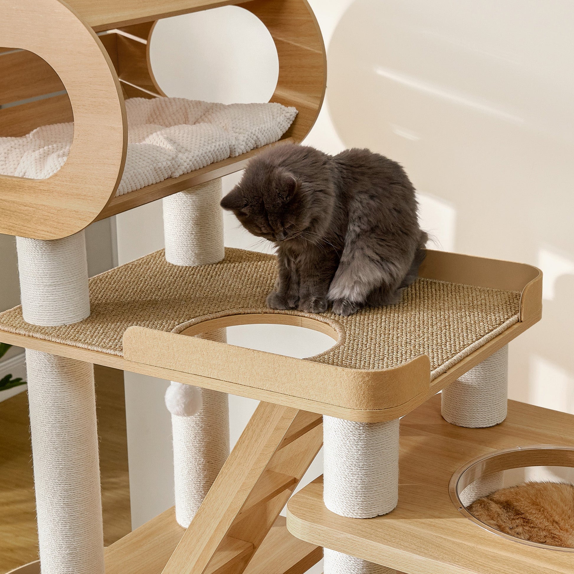 Eureka Ergonomic Fluffy gray cat on Babylon 76" cat tree perch with sisal rope posts and natural wood finish.