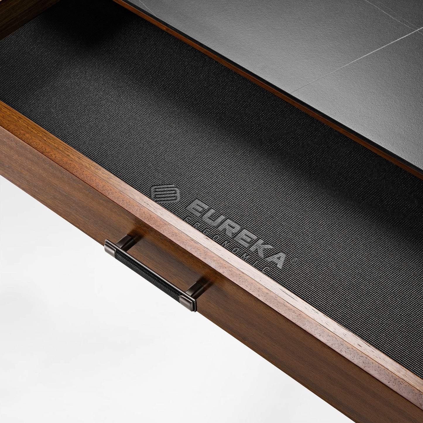 Eureka Ergonomic Ark Pro L-Shaped Desk Drawer Detail With Black Fabric, Wood, and Logo.